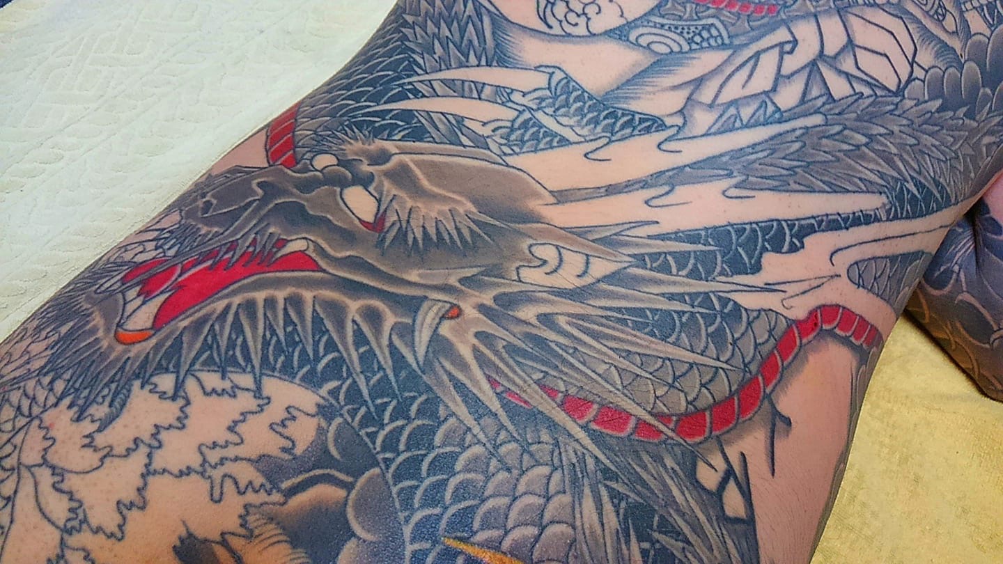 A big piece tattooed from Horikoi depicting an unfinished dragon.