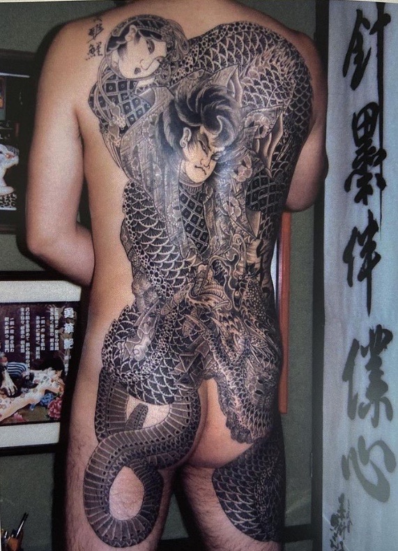 Japanese Hero tattooed one a mans back.