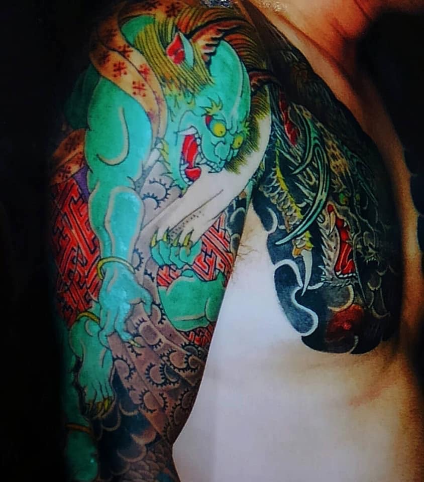 Fujin, Japanese God of wind tattooed on Chest and arm of man. Picture from the 80's.
80's tattoo. Irezumi.