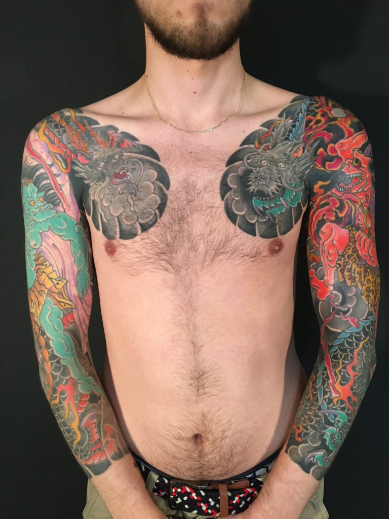 Fujin and Raijin, Japanese Gods of wind and thunder tattooed on Chest and arm of man. Irezumi, Horimono ans Wabori to be seen on Skin.