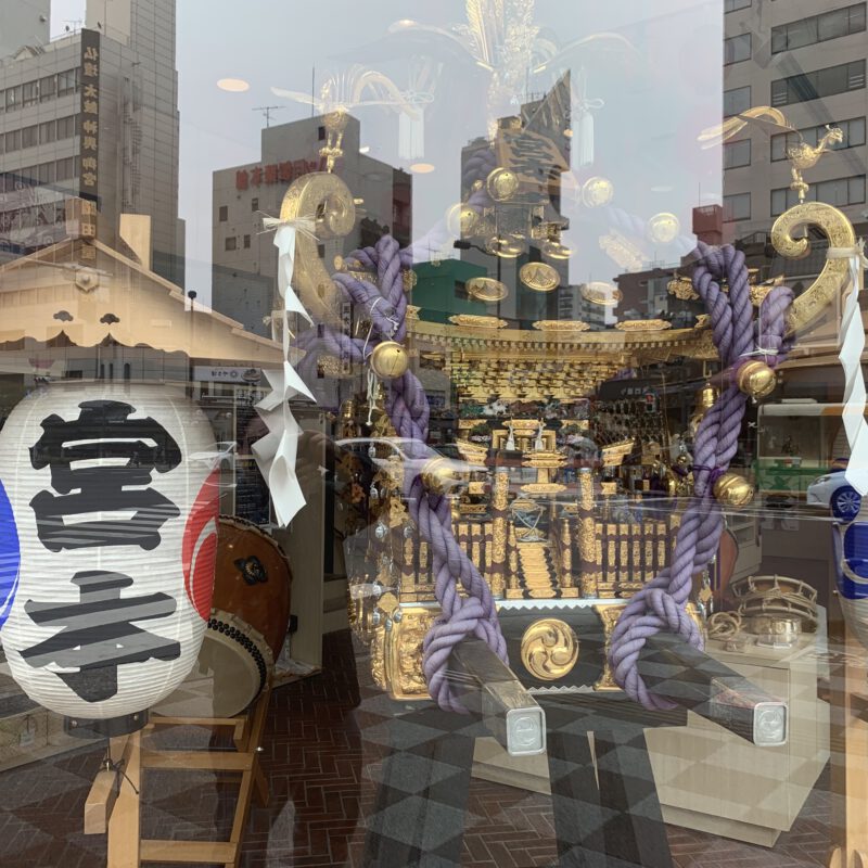 portable shrine called Mikoshi as a reflection in the city of Tokio.