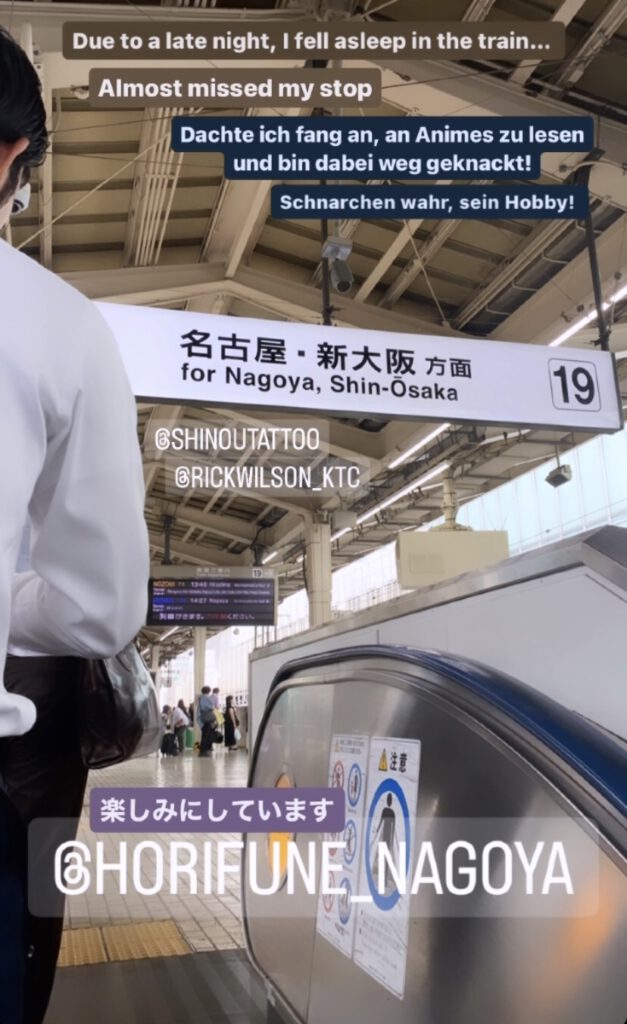 White collar worker standing on escalator going up to the train tracks toward Nagoya and Osaka. The sign showing the city names and track number 19 for direction. The foto is taken in an upright position so a majority of the roof can be seen from the inside.